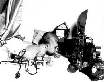 [Ed Bernd as a baby, and a Speed Graphic]
